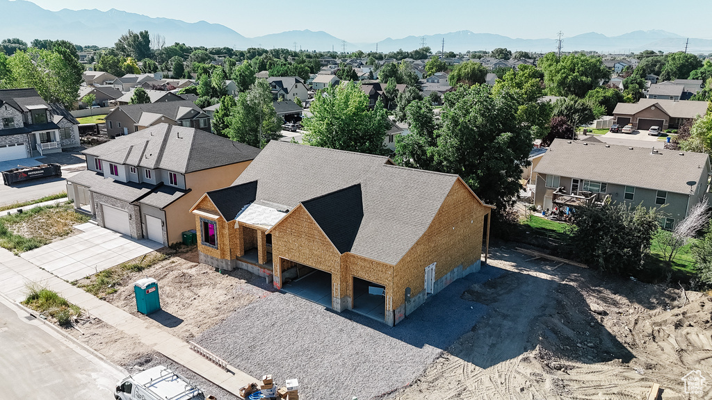 Aerial perspective of suburban area with a mountainous background