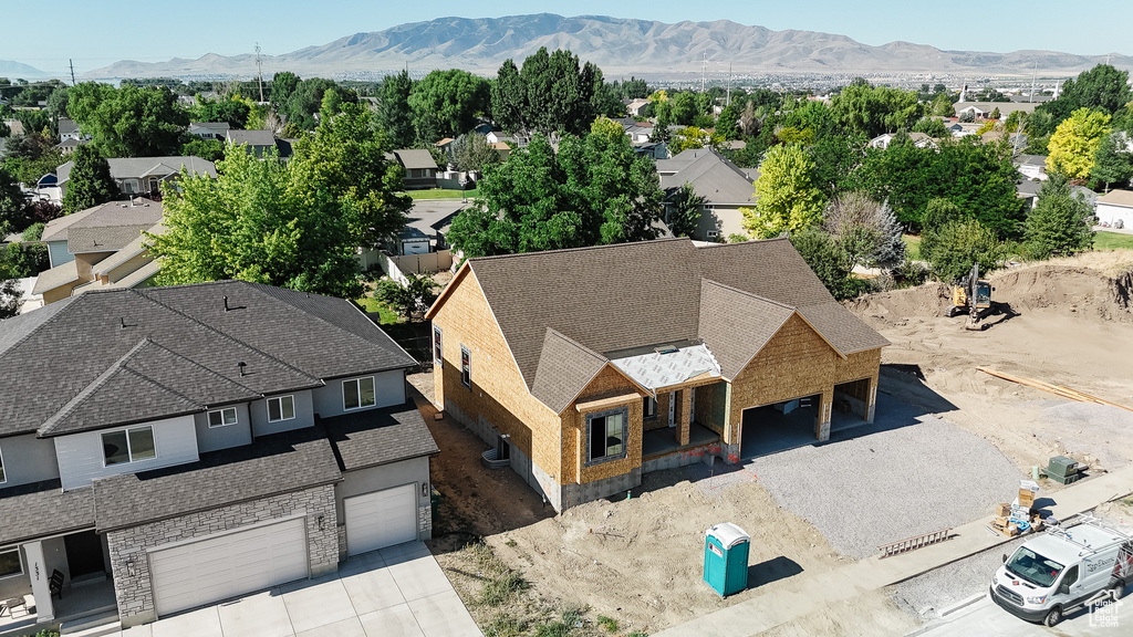 Aerial view of residential area with a mountainous background