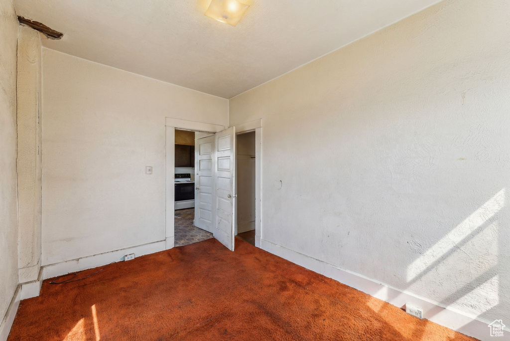 Interior space with carpet floors and baseboards