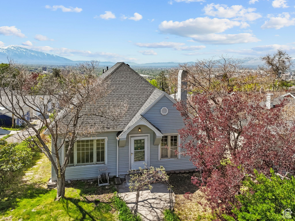 View of front of property featuring a shingled roof