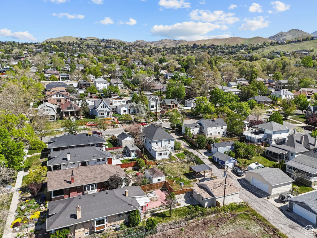 Birds eye view of property with a residential view and a mountain view