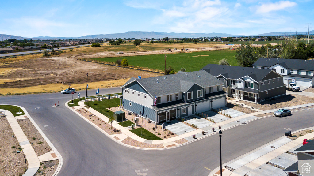 Birds eye view of property with a mountain view