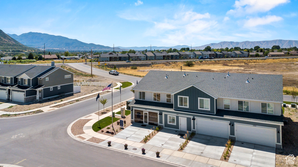 Drone / aerial view featuring a mountain view and a residential view