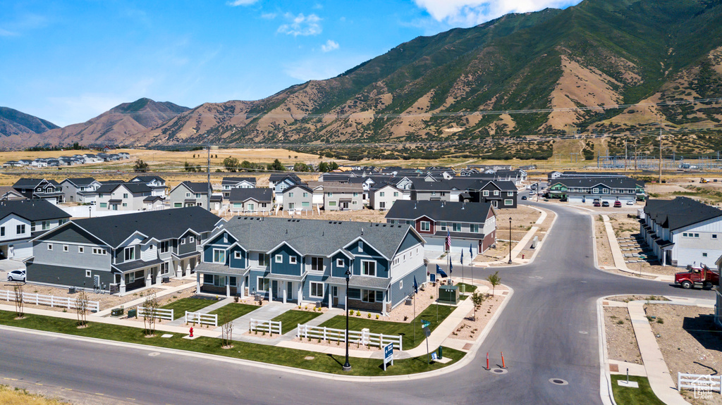 Property view of mountains with a residential view