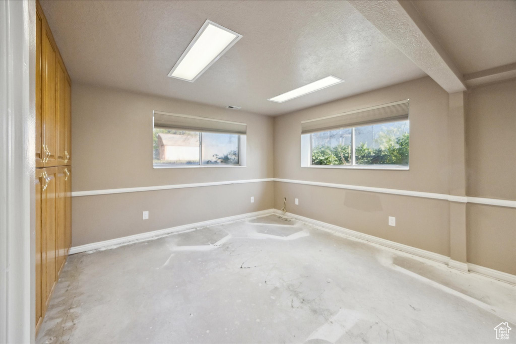Spare room featuring baseboards