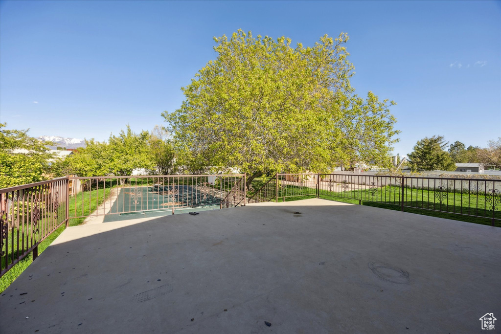 View of patio / terrace featuring fence and a fenced in pool