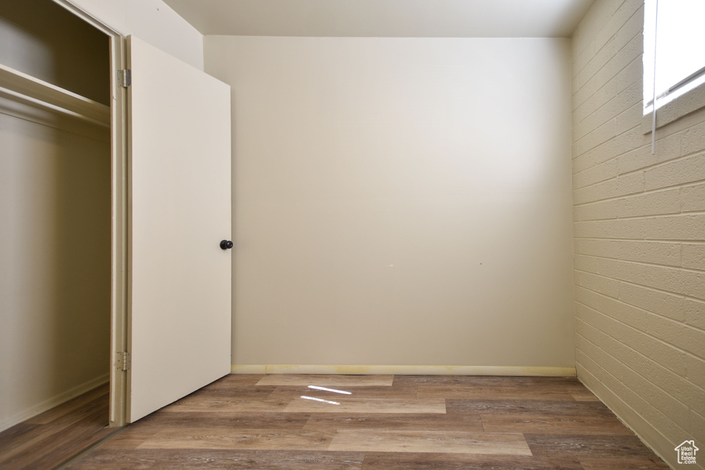 Unfurnished bedroom featuring wood finished floors