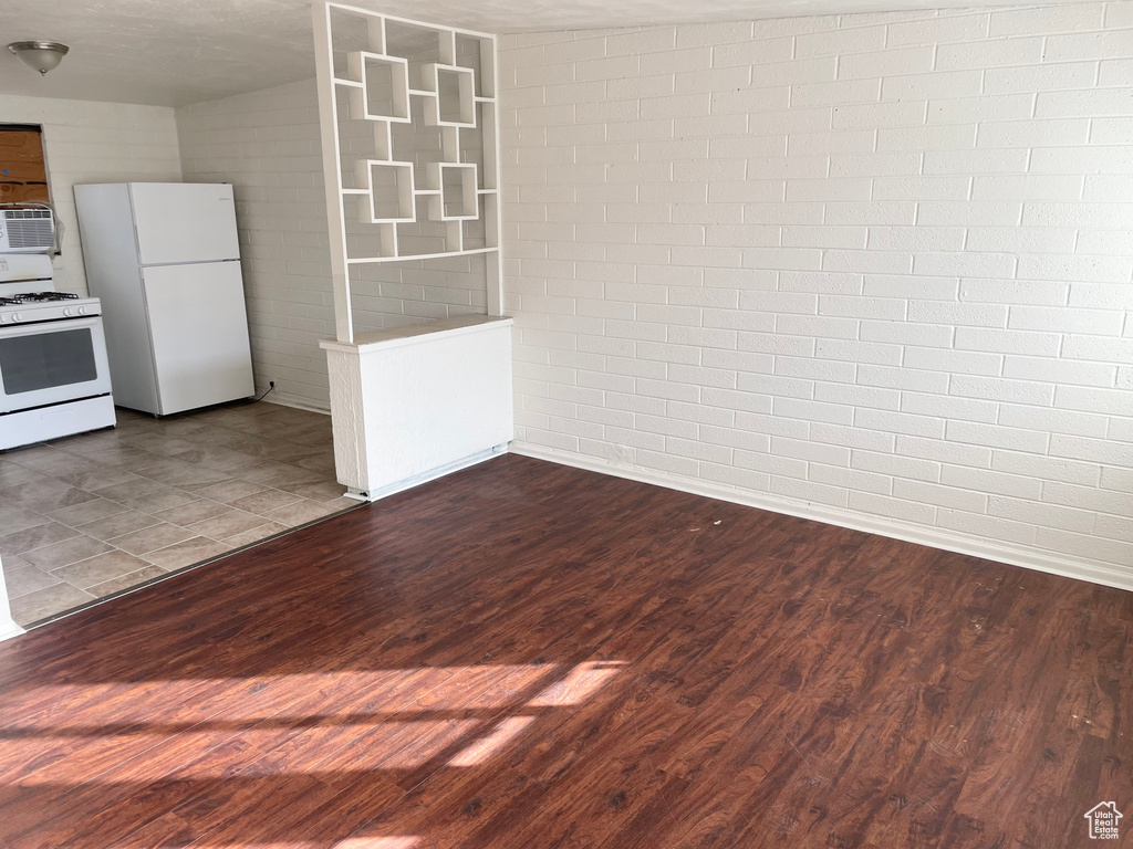 Interior space featuring baseboards and dark wood finished floors