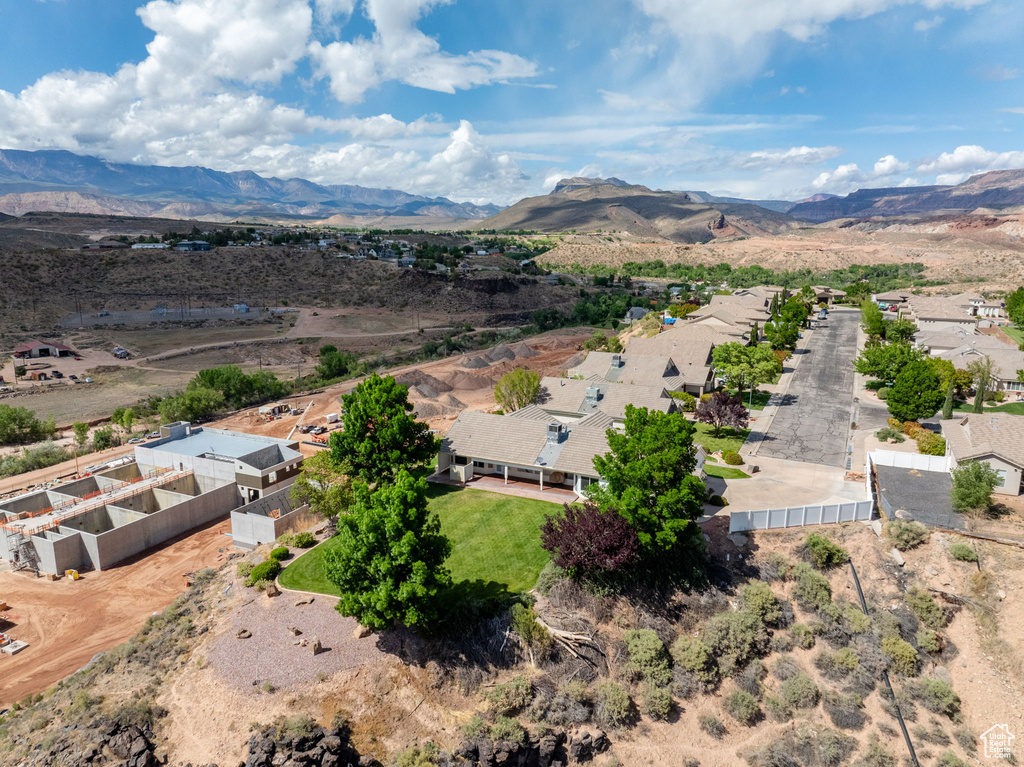 Birds eye view of property with a residential view and a mountain view
