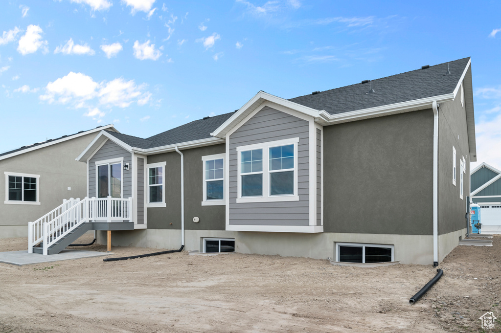 View of front of home with a shingled roof