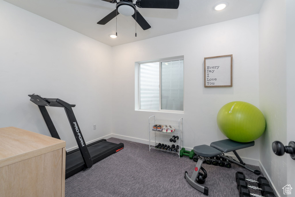 Exercise room featuring baseboards, recessed lighting, ceiling fan, and dark colored carpet