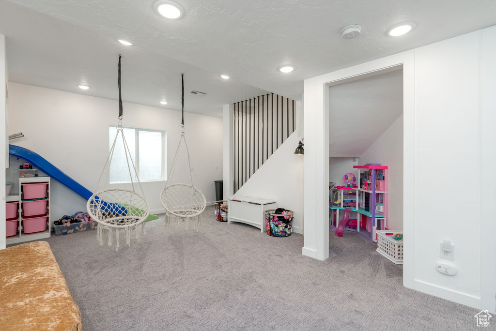 Rec room with baseboards, carpet flooring, and recessed lighting
