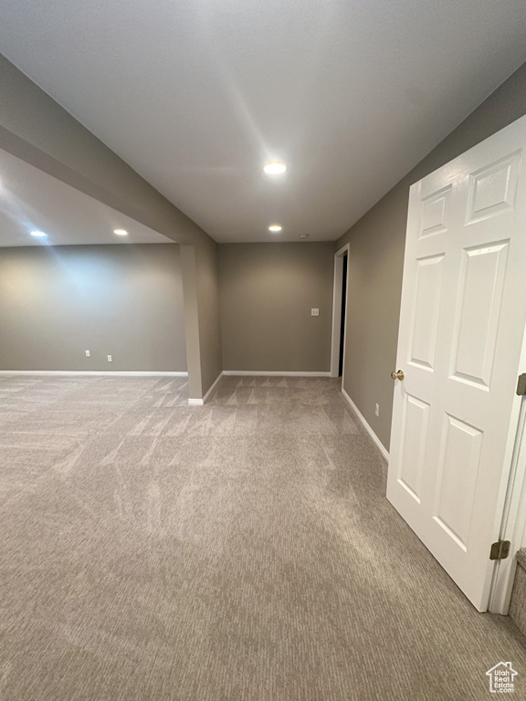 Finished basement with baseboards, carpet flooring, and recessed lighting