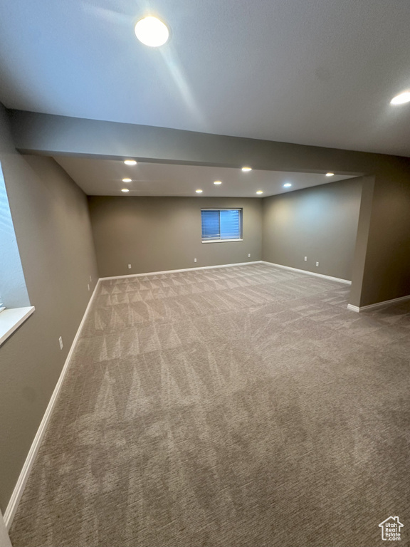 Below grade area with carpet floors, recessed lighting, and baseboards