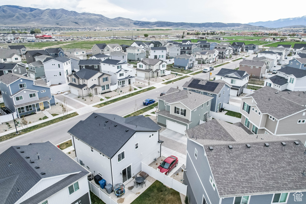 Birds eye view of property with a residential view and a mountain view