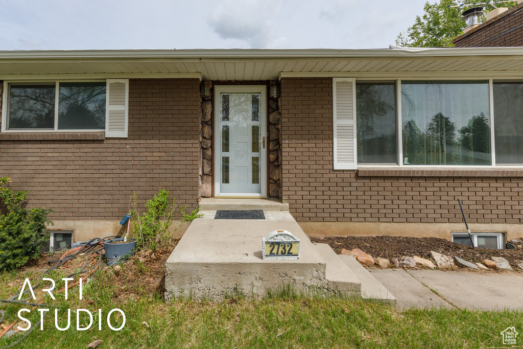 Property entrance with brick siding