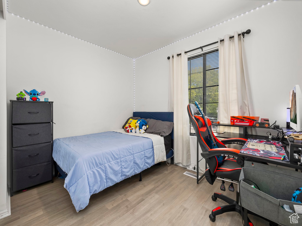Bedroom with wood finished floors