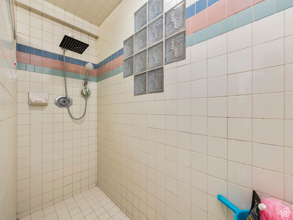 Full bathroom with a tile shower