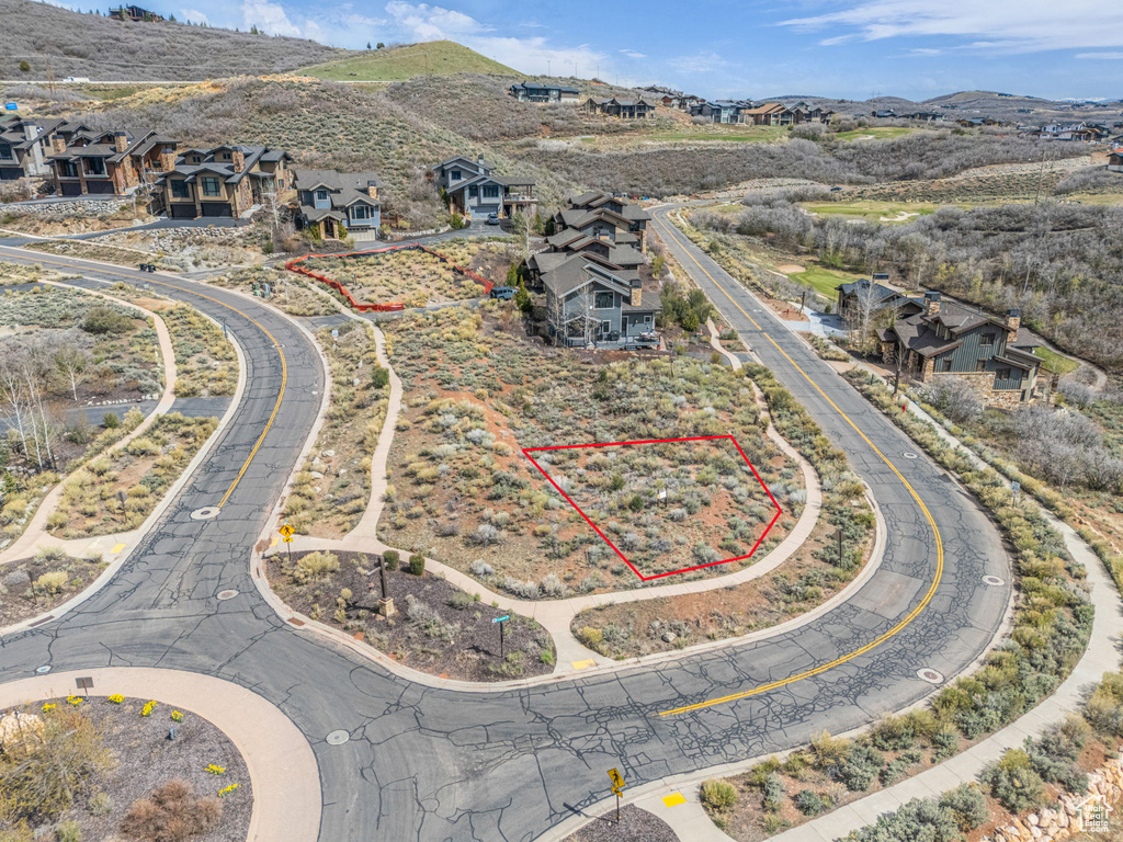 Birds eye view of property with a residential view and a mountain view