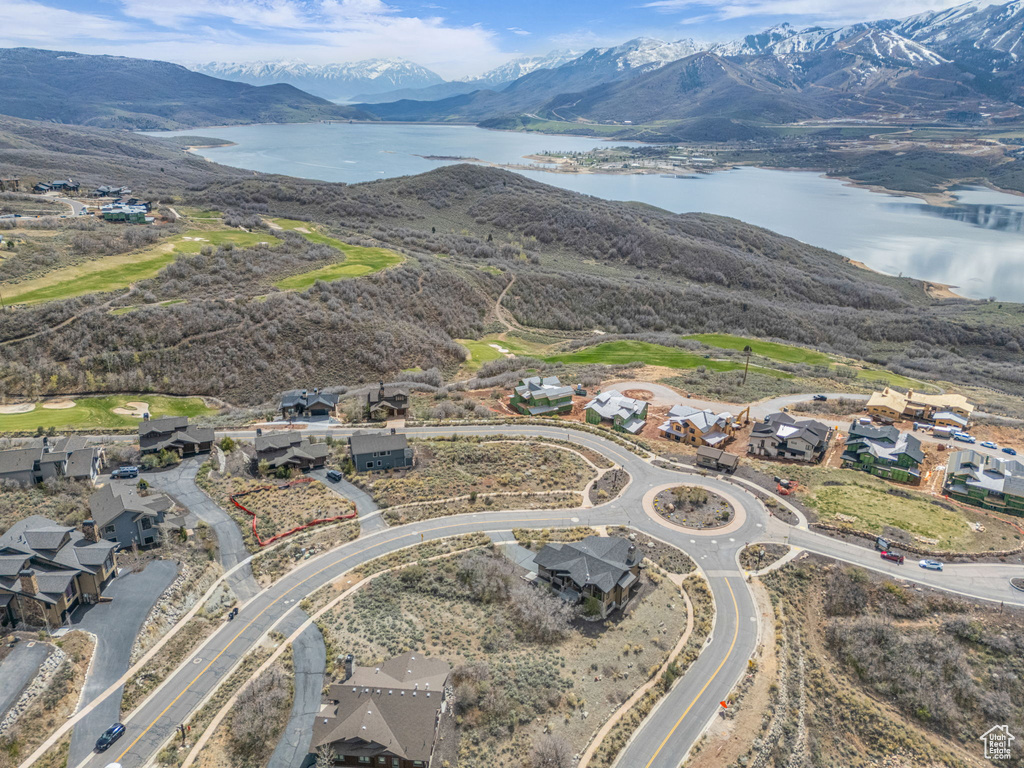Birds eye view of property with a residential view and a water and mountain view