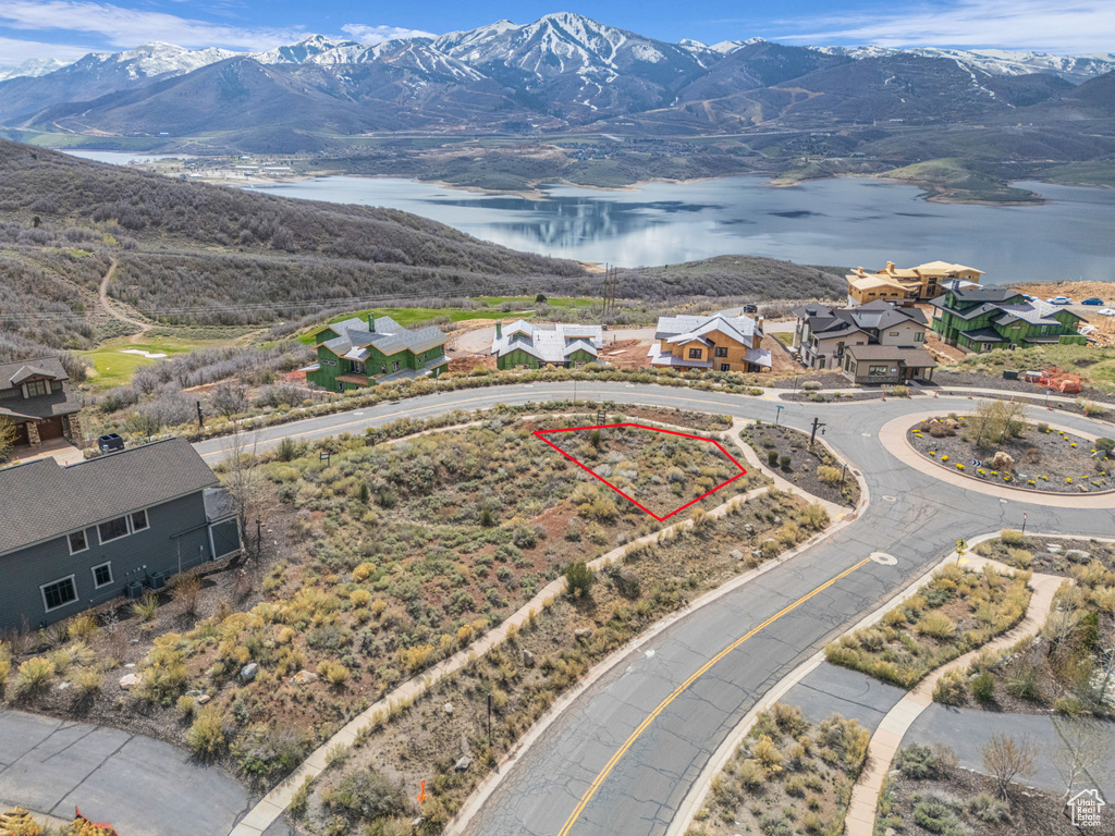 Aerial view featuring a water and mountain view and a residential view