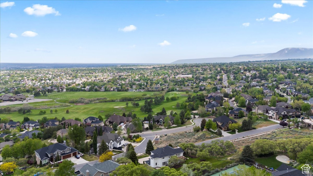 Drone / aerial view with a residential view, a mountain view, and golf course view