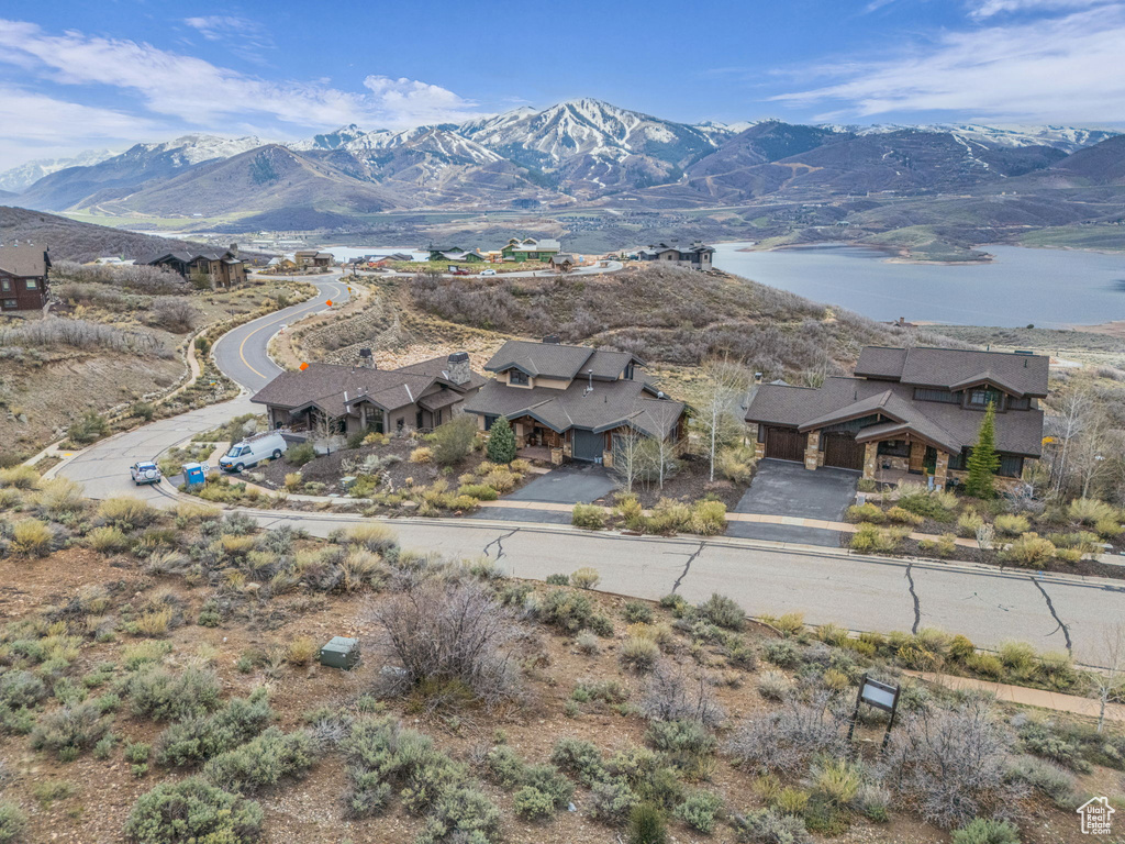 Property view of mountains with a water view