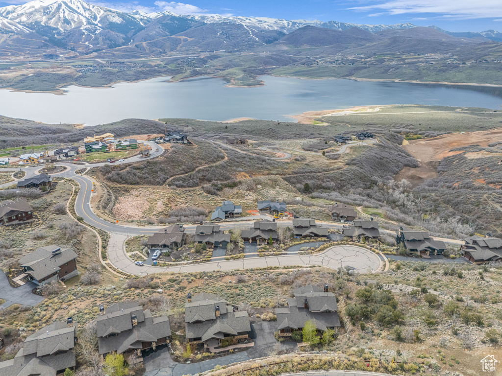 Drone / aerial view with a water and mountain view