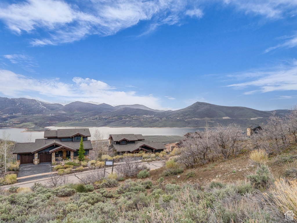 Property view of mountains with a water view
