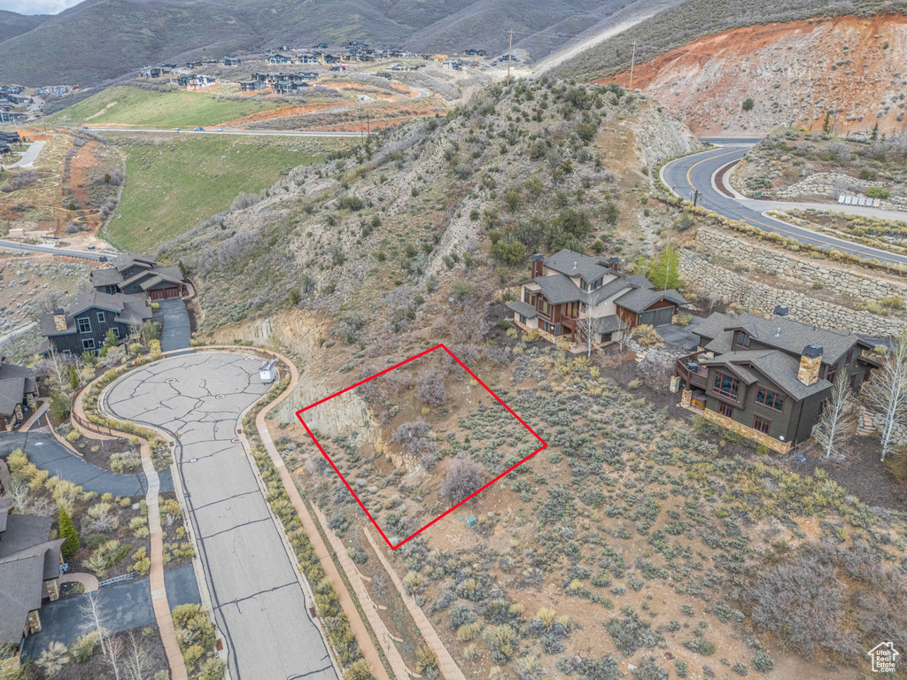 Birds eye view of property with a mountain view