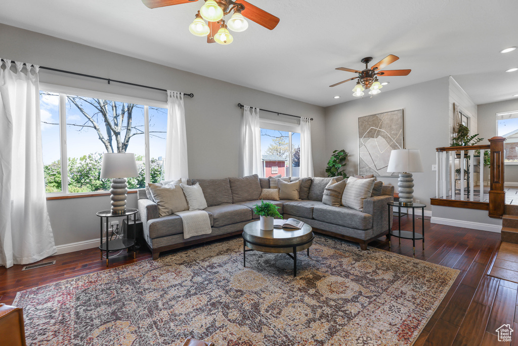 Living room with recessed lighting, ceiling fan, baseboards, and hardwood / wood-style flooring