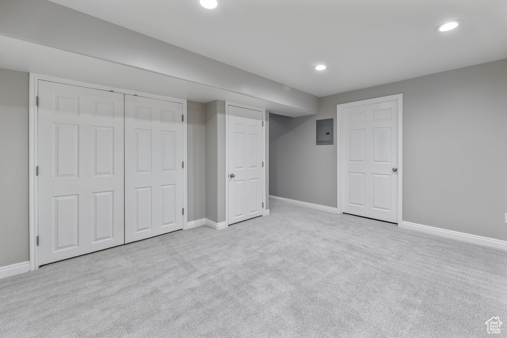 Finished basement featuring recessed lighting, carpet flooring, baseboards, and electric panel