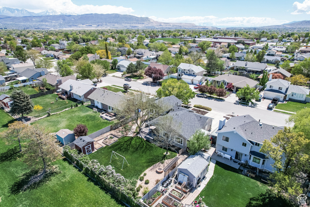 Drone / aerial view with a residential view and a mountain view