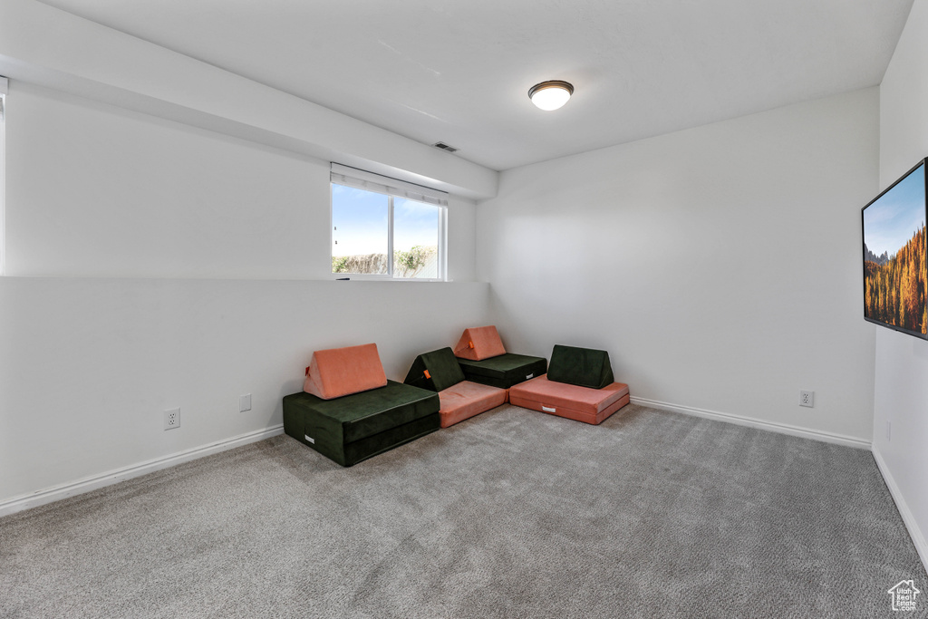 Unfurnished room with baseboards and carpet