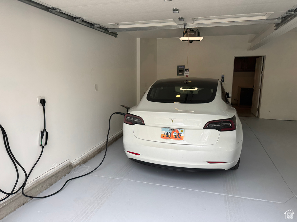 Garage featuring a garage door opener
