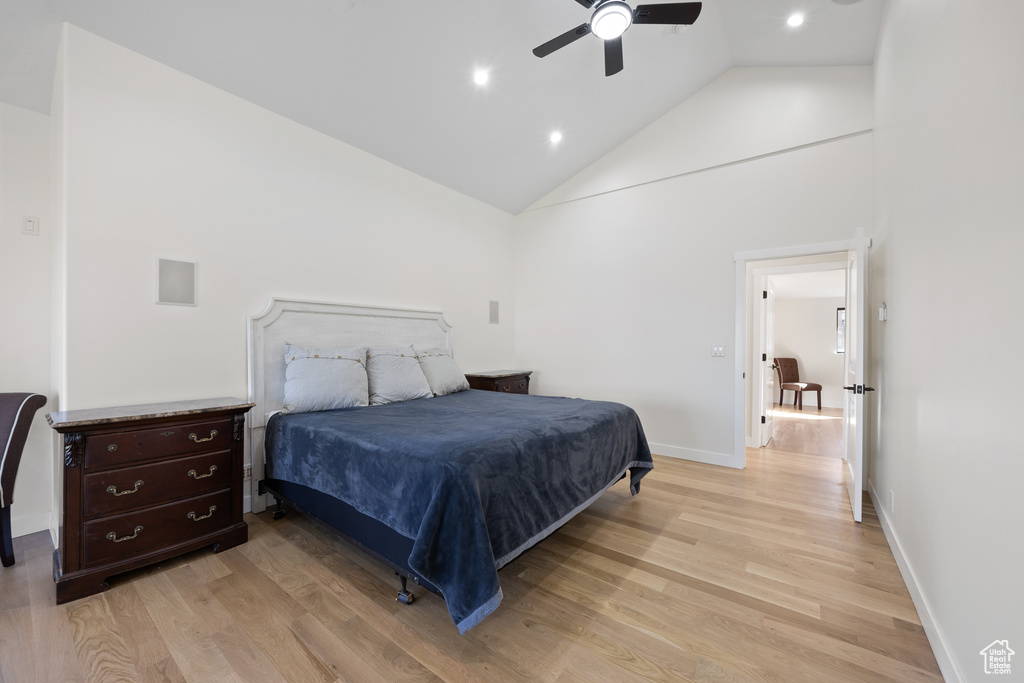 Bedroom with ceiling fan, light wood-type flooring, high vaulted ceiling, baseboards, and recessed lighting