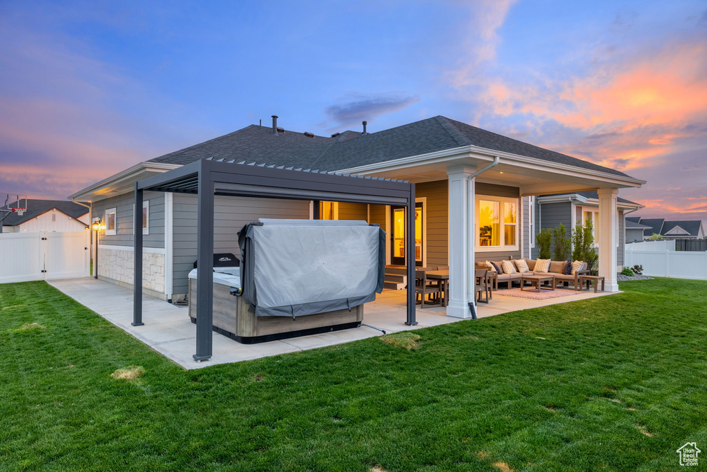 Rear view of property with a lawn, outdoor lounge area, a patio, and a fenced backyard