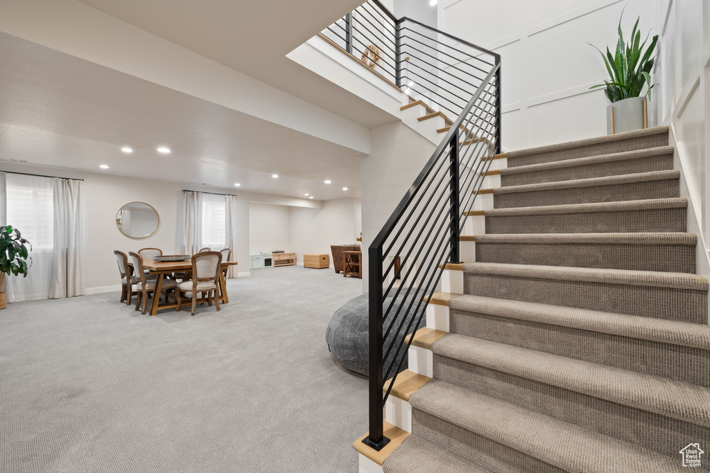 Stairs featuring carpet, recessed lighting, and baseboards
