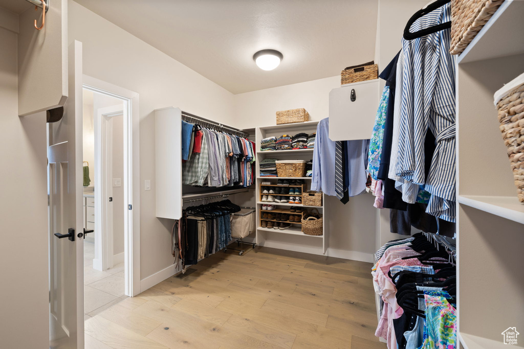 Spacious closet with light wood-type flooring