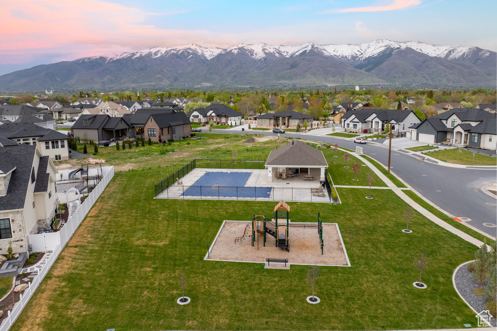 Birds eye view of property with a mountain view and a residential view