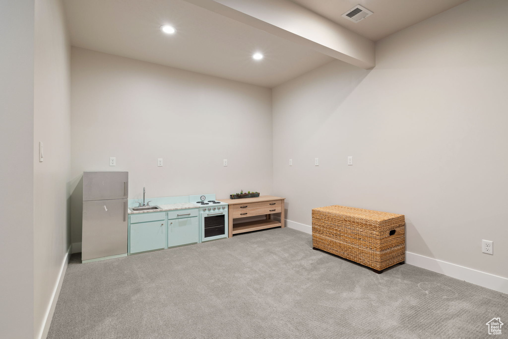 Misc room featuring recessed lighting, light carpet, a sink, baseboards, and visible vents