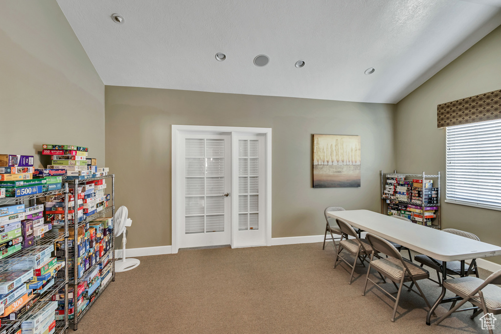 Office space with recessed lighting, baseboards, light carpet, and lofted ceiling