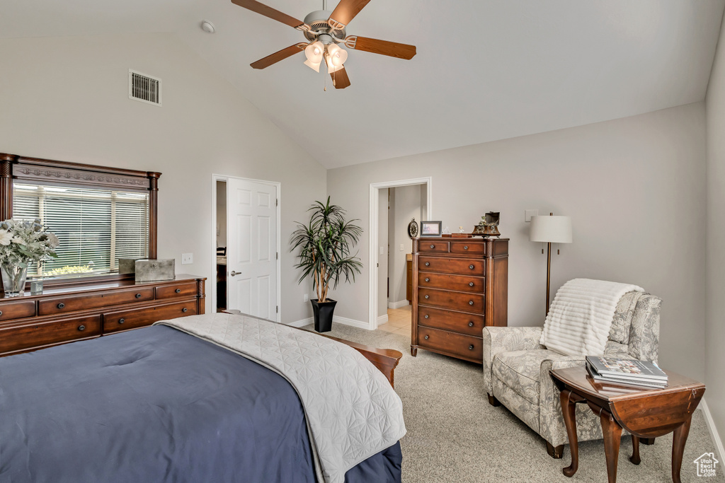 Bedroom with visible vents, light carpet, baseboards, high vaulted ceiling, and a ceiling fan
