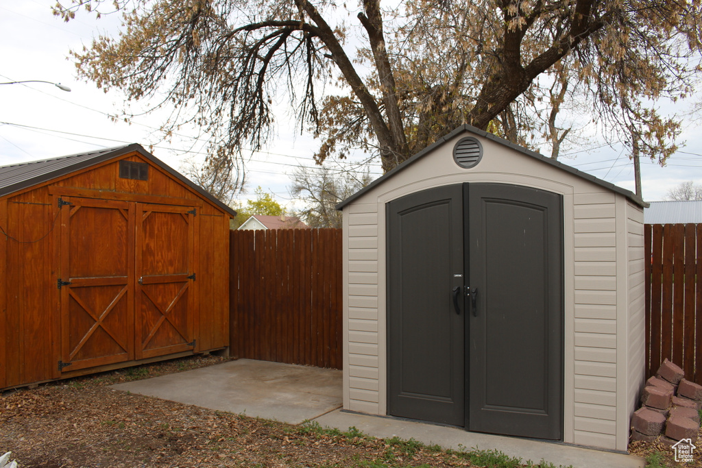 View of shed featuring a fenced backyard
