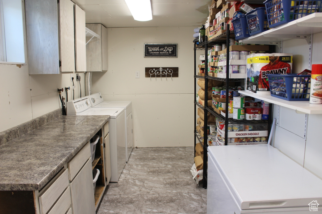 Laundry area with cabinet space and washing machine and dryer
