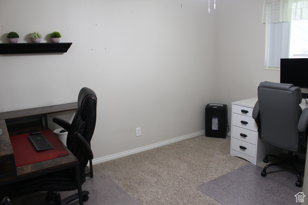 Office space featuring baseboards and carpet flooring