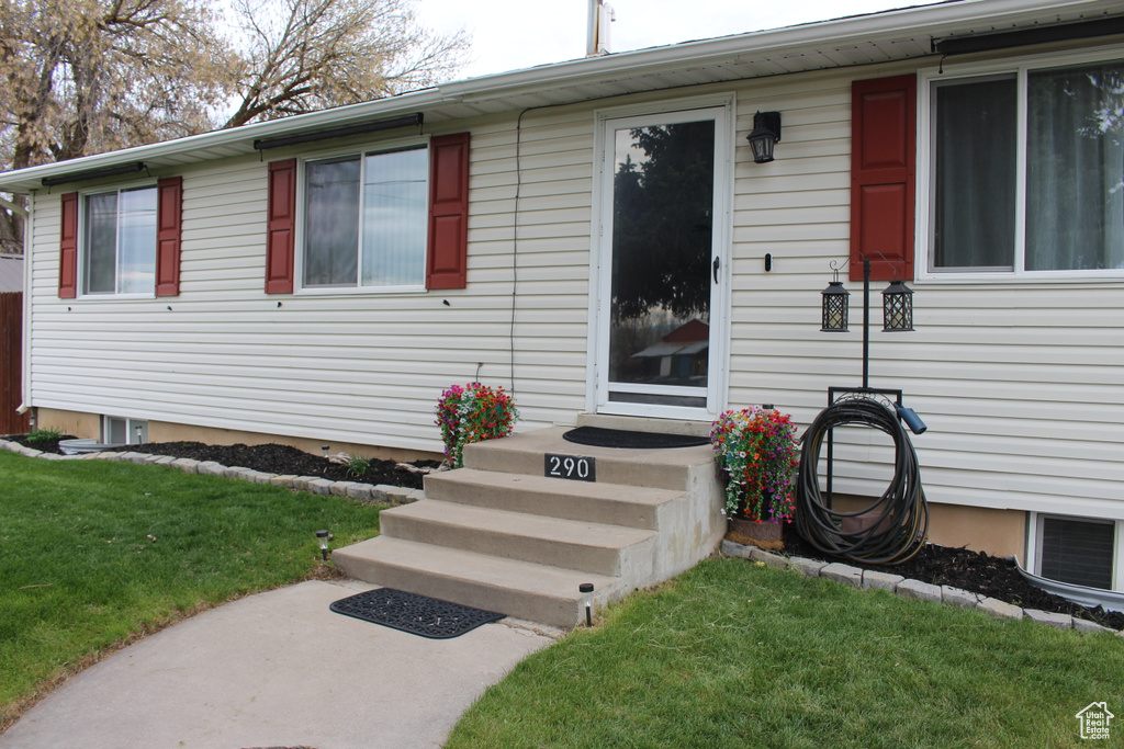 View of front of house with a front yard