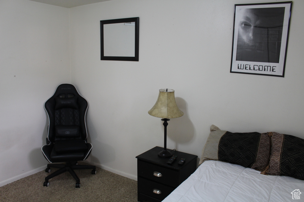 Carpeted bedroom featuring baseboards