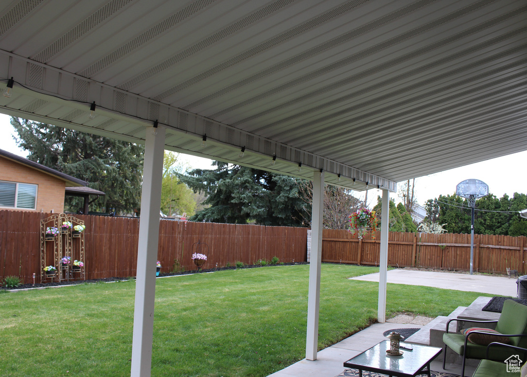 View of yard featuring a fenced backyard and a patio area