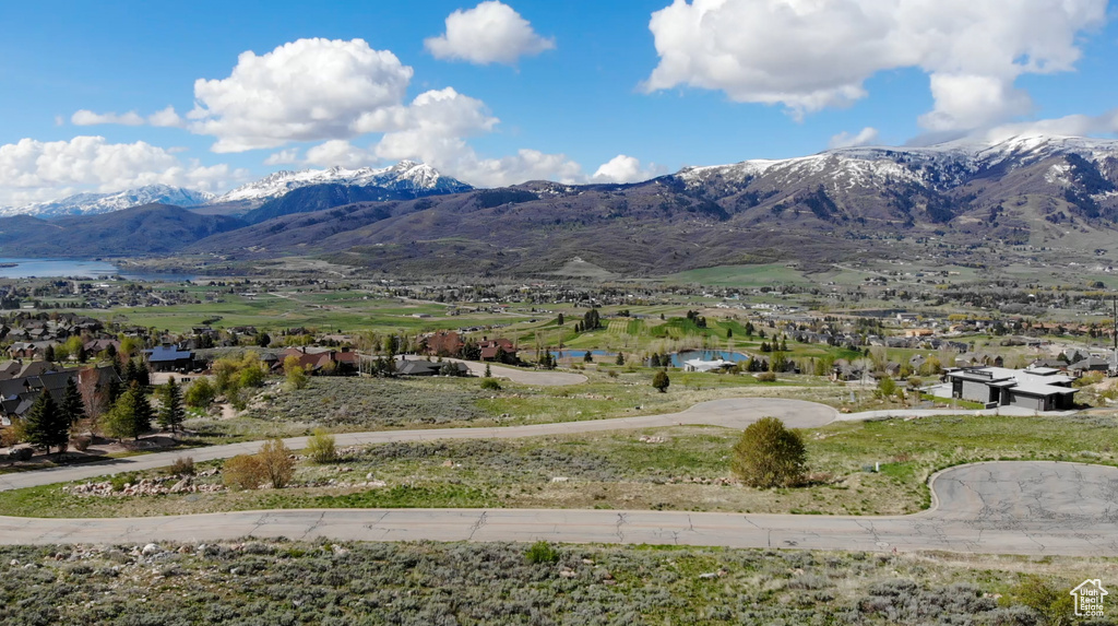Property view of mountains with a water view